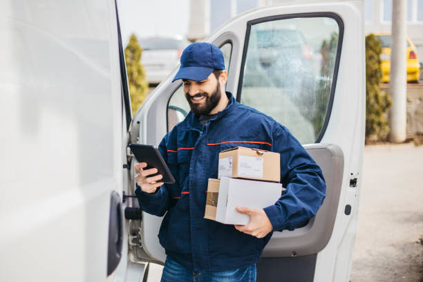 Delivery man scanning package
